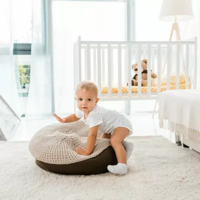 adorable toddler in white nursery room adorable toddler in white nursery room